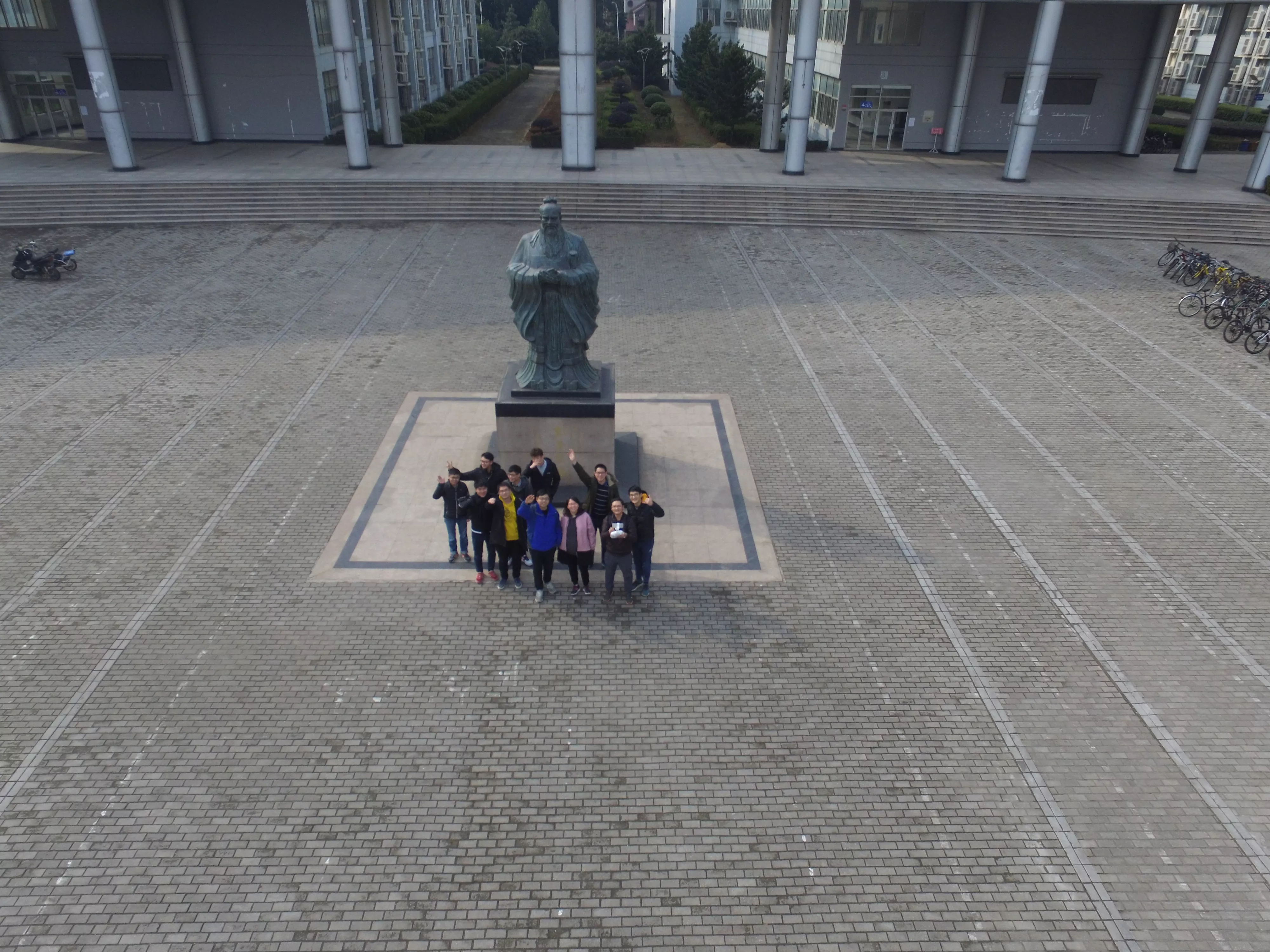 Group photo with Confucius sculpture